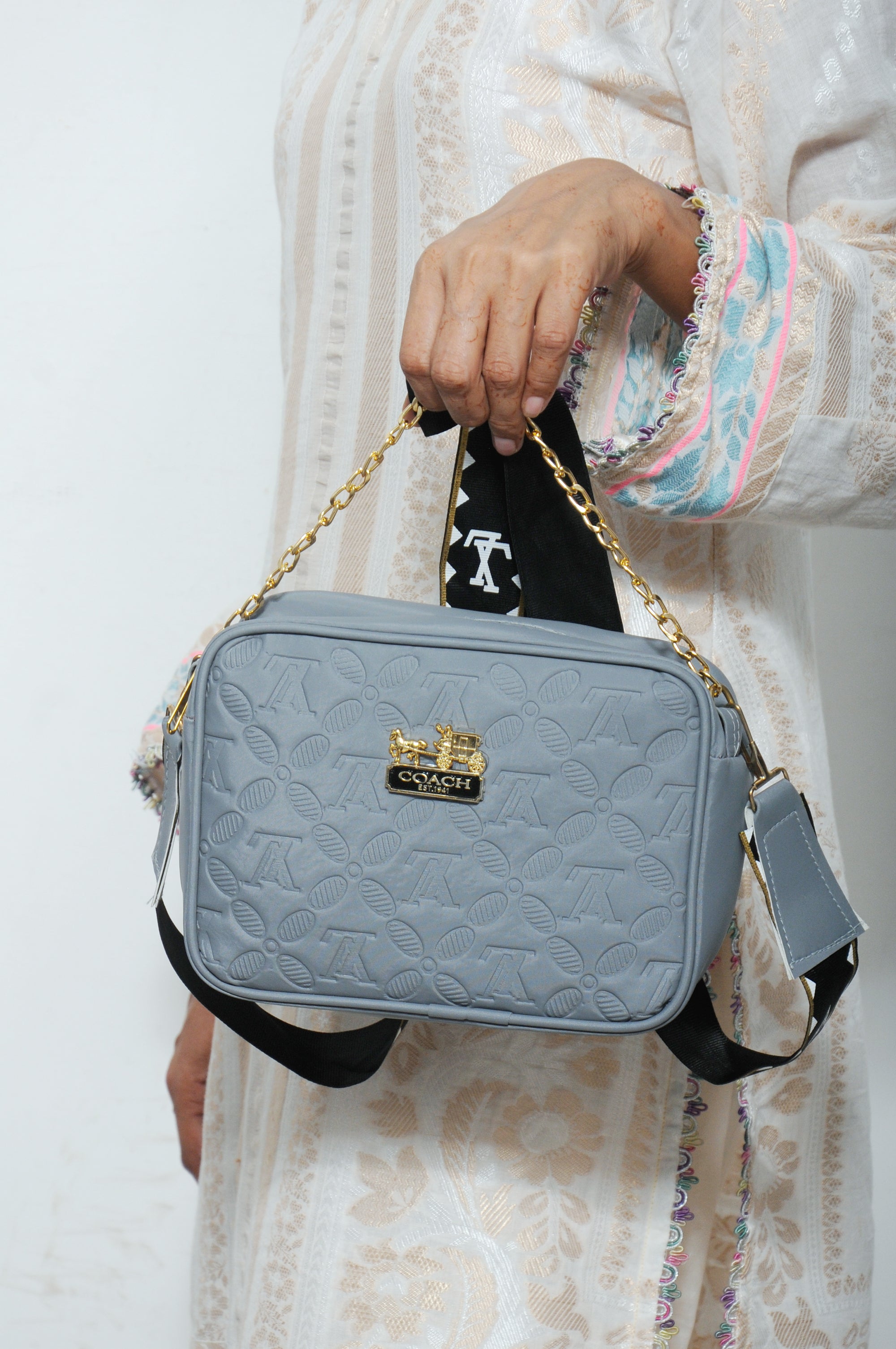 Embossed Monogram Crossbody Bag with Woven Strap & Gold Chain